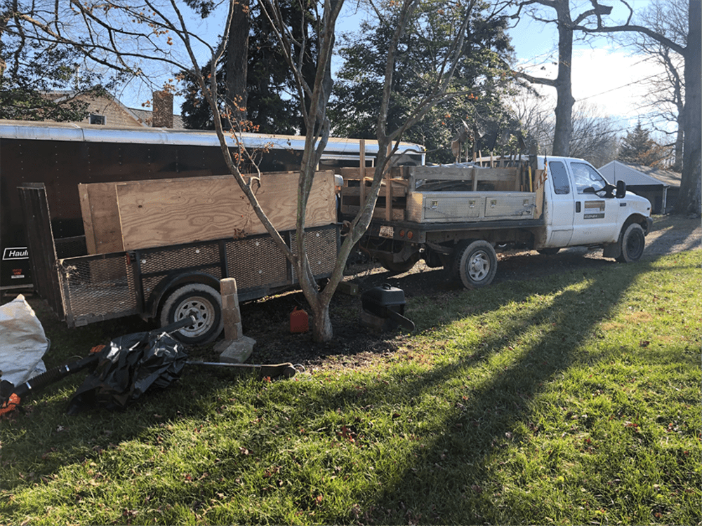 Zeke’s landscaping truck and trailer at a residential property
